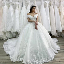 Load image into Gallery viewer, Off Shoulder Lace Embroidery Train Bridal Gown
